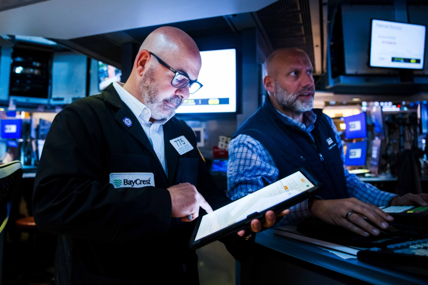 Dow climbs above 52,000 for first time as oil prices fall, but tech sell-off knocks down S&P 500: Live updates – CNBC