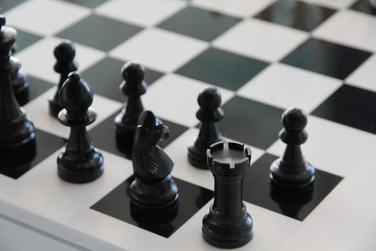 Chess pieces on a board, illustrating Bodhana Sivanandan's chess record