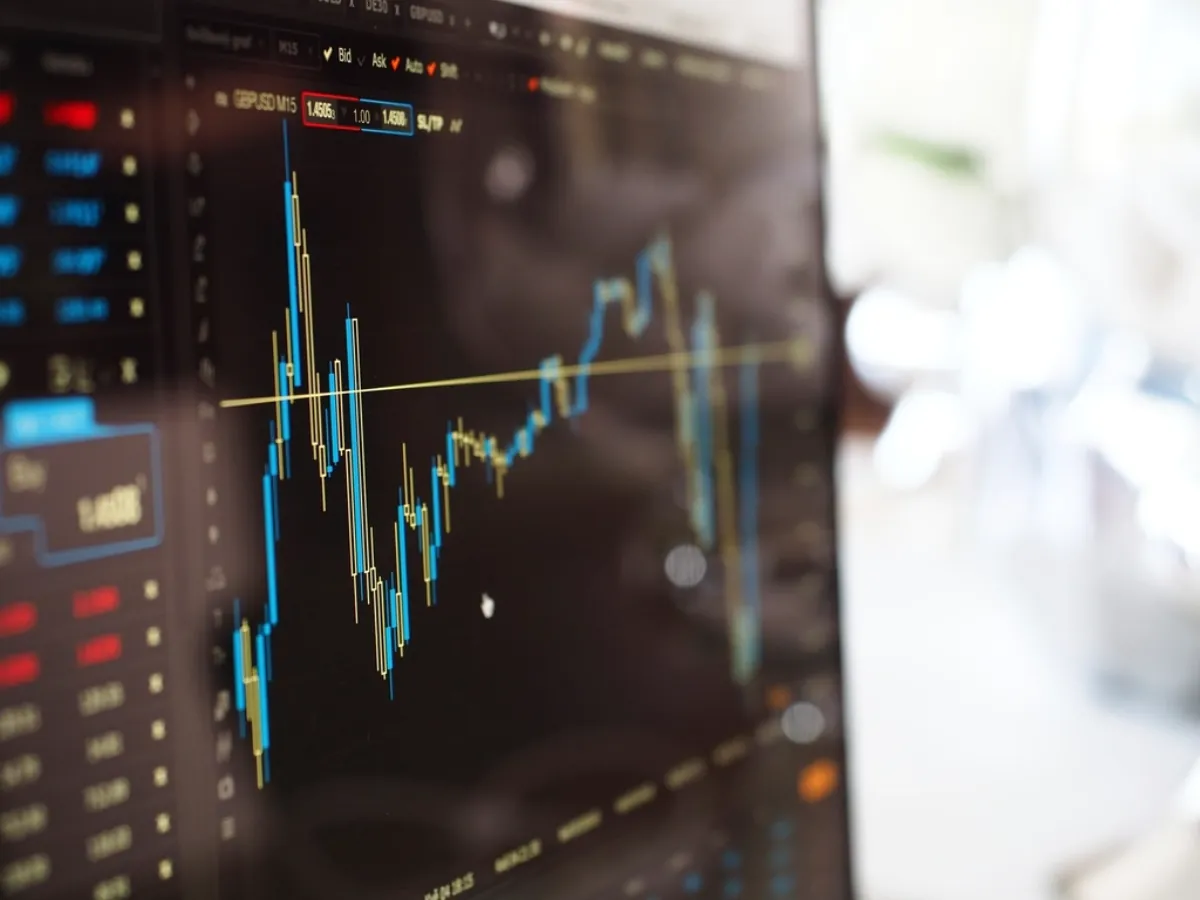 Stock market graphs on a screen, illustrating Jio IPO allotment news