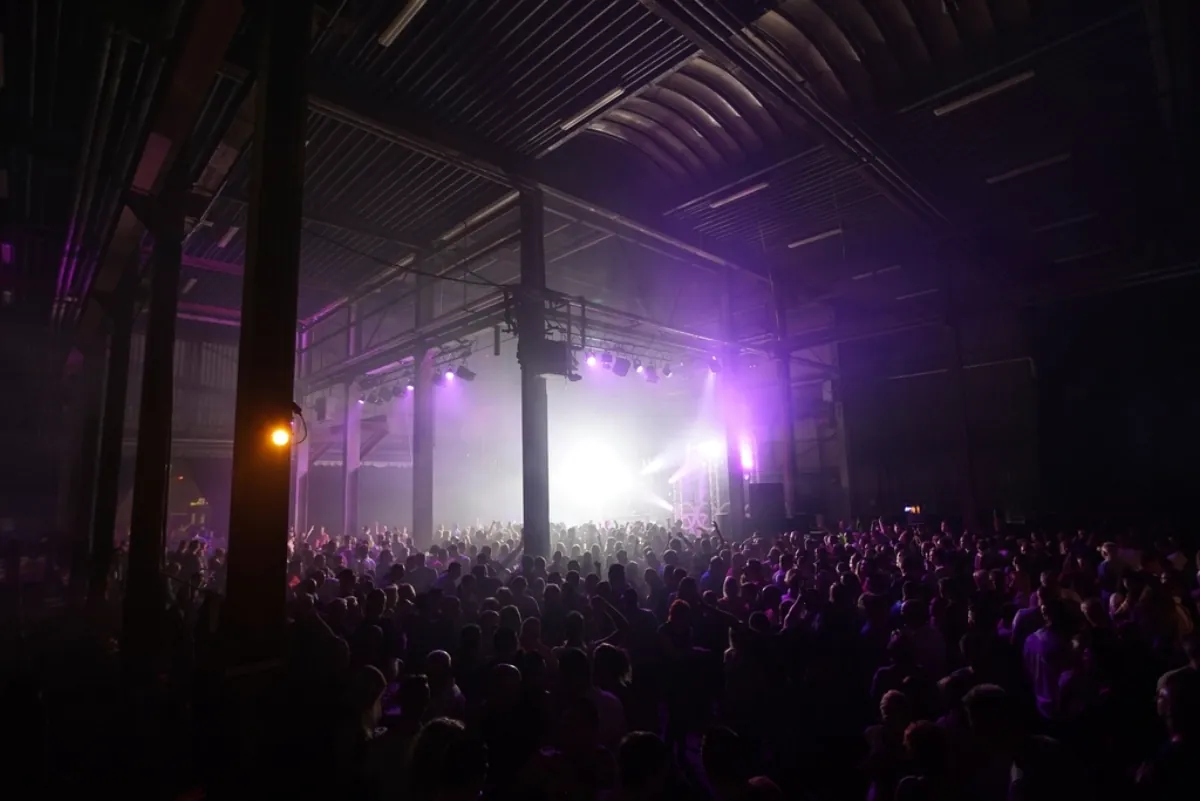 Concert crowd in front of a stage, illustrating Shilpa Rao mic cut off at music show