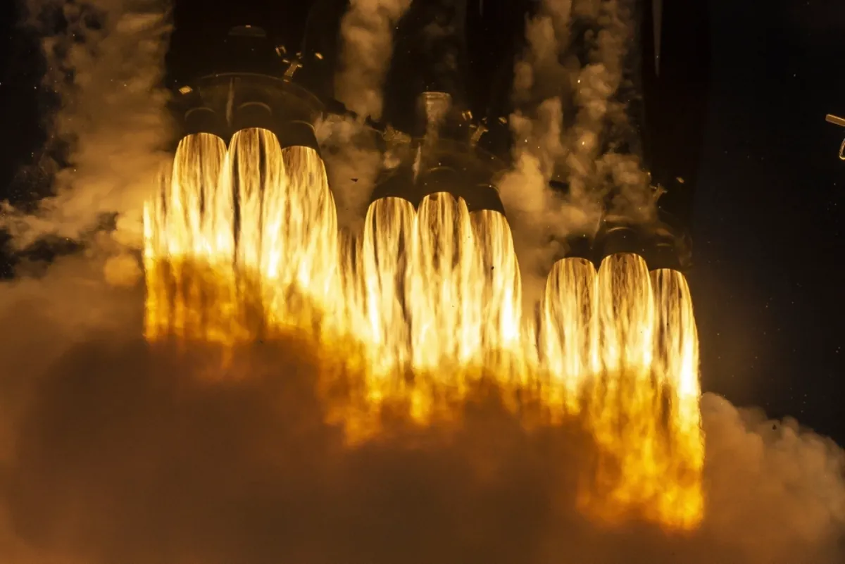 Rocket engines firing at launch, illustrating Starship Moon landing plans